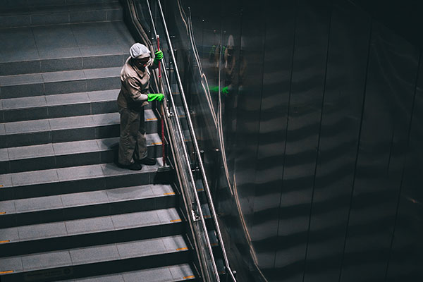 Woman cleaning stairs